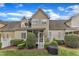 Exterior backyard view of this home, showcasing landscaping and a cozy screened porch at 625 Canvas Dr, Wake Forest, NC 27587