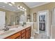 Well-lit bathroom features a double sink vanity, and a walk-in closet to provide ample storage space at 625 Canvas Dr, Wake Forest, NC 27587