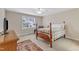 Comfortable bedroom with a large window, ceiling fan, and wooden furnishings at 625 Canvas Dr, Wake Forest, NC 27587