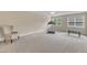Spacious bedroom with neutral walls, ceiling fan and two windows providing ample light at 625 Canvas Dr, Wake Forest, NC 27587
