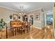 Traditional dining room featuring hardwood floors, a chandelier, and a wooden dining table at 625 Canvas Dr, Wake Forest, NC 27587