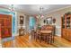 Elegant dining room with hardwood floors, chandelier, and plenty of natural light at 625 Canvas Dr, Wake Forest, NC 27587
