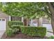 Well-maintained brick home with manicured hedges and a welcoming covered entryway at 625 Canvas Dr, Wake Forest, NC 27587