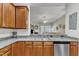 Well-lit kitchen featuring granite countertops, stainless steel appliances, and seamless connectivity to the living room at 625 Canvas Dr, Wake Forest, NC 27587