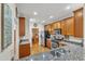 Spacious kitchen with stainless steel appliances, granite countertops, and hardwood floors throughout at 625 Canvas Dr, Wake Forest, NC 27587