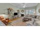 Cozy living room with fireplace, large sectional sofa, and built-in shelving at 625 Canvas Dr, Wake Forest, NC 27587