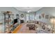 Charming living room featuring a fireplace, sectional sofa, and hardwood flooring at 625 Canvas Dr, Wake Forest, NC 27587