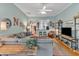 Inviting living room with stylish decor, hardwood floors, and an open view to kitchen and bar area at 625 Canvas Dr, Wake Forest, NC 27587
