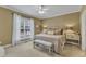 Relaxing main bedroom with a king bed, neutral decor, and plenty of natural light at 625 Canvas Dr, Wake Forest, NC 27587