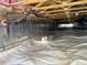 Encapsulated crawlspace showing clean white vapor barrier, insulation, and beams at 6904 Fox Haven Pl, Raleigh, NC 27616