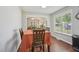 Bright dining area showcases hardwood floors and a living room at 6904 Fox Haven Pl, Raleigh, NC 27616