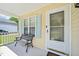 Welcoming porch features a bench, a screened door, light blue shutters, and a cozy spot to relax at 6904 Fox Haven Pl, Raleigh, NC 27616