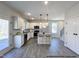 Bright kitchen featuring white cabinets, stainless steel appliances, and an island at 79 Butterbean Ct, Zebulon, NC 27597