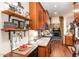 Gourmet kitchen with custom cabinets, granite countertops, stainless appliances, and hardwood floors at 8005 Crookneck Dr, Angier, NC 27501