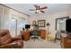 Home office featuring a large desk, comfortable seating, and plenty of natural light at 8005 Crookneck Dr, Angier, NC 27501