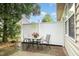 Covered patio with outdoor seating, perfect for relaxing and entertaining at 8005 Crookneck Dr, Angier, NC 27501