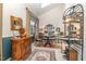 Cozy sitting room featuring tiled floors, a vintage table set, and ample natural light at 8005 Crookneck Dr, Angier, NC 27501