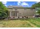 Back of house showing windows and porch overlooking lawn and trees on a sunny day at 809 Parkridge Dr, Clayton, NC 27527