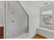 Bathroom with glass shower, a white window seat and hardwood floors at 809 Parkridge Dr, Clayton, NC 27527