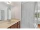 Bathroom with vanity sink, glass shower and large mirror at 809 Parkridge Dr, Clayton, NC 27527