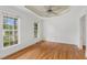 Bright bedroom with hardwood floors, crown molding, and multiple windows offering ample natural light at 809 Parkridge Dr, Clayton, NC 27527