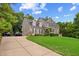 Beautiful two-story home featuring an attached two-car garage and long driveway at 809 Parkridge Dr, Clayton, NC 27527