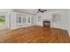 Spacious living room with hardwood floors, a cozy fireplace, and built-in cabinets at 809 Parkridge Dr, Clayton, NC 27527