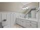 Upstairs bathroom features a large vanity with storage, sleek fixtures, and tiled floors at 8232 Glynmorgan Way, Chapel Hill, NC 27516