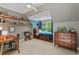 Bright bedroom featuring a day bed, built-ins and decorative shelves and lots of natural light at 8232 Glynmorgan Way, Chapel Hill, NC 27516