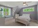 Comfortable bedroom with built-in window seating, neutral colors, and bright, natural light at 8232 Glynmorgan Way, Chapel Hill, NC 27516