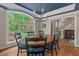 Elegant dining room featuring hardwood floors, ample natural light, and backyard views at 8232 Glynmorgan Way, Chapel Hill, NC 27516