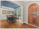 Elegant dining room featuring hardwood floors, ample natural light, and arched entryways at 8232 Glynmorgan Way, Chapel Hill, NC 27516