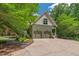 Charming two-story home with a stone walkway, well-manicured lawn, and a two-car garage at 8232 Glynmorgan Way, Chapel Hill, NC 27516