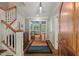Inviting foyer boasts hardwood floors, elegant staircase, and seamless flow into the living area at 8232 Glynmorgan Way, Chapel Hill, NC 27516