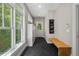 Hallway with herringbone floors, a storage cabinet, and lots of natural light at 8232 Glynmorgan Way, Chapel Hill, NC 27516