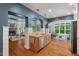 Open-concept kitchen with hardwood floors, stainless steel appliances, and views of the living room at 8232 Glynmorgan Way, Chapel Hill, NC 27516