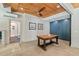 Bright room with concrete floors, wood table, custom cabinets and bathroom access at 8232 Glynmorgan Way, Chapel Hill, NC 27516