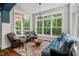 Bright living room with hardwood floors, ample natural light, and comfortable seating at 8232 Glynmorgan Way, Chapel Hill, NC 27516