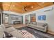 Well-lit living room with wood ceiling, polished floors and comfortable seating at 8232 Glynmorgan Way, Chapel Hill, NC 27516