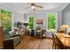 Bright home office with hardwood floors and large windows providing lots of natural light at 8232 Glynmorgan Way, Chapel Hill, NC 27516
