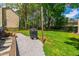 Expansive backyard with a well-maintained lawn and a convenient grill area, great for outdoor cooking and activities at 8613 Swarthmore Dr, Raleigh, NC 27615