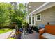 Cozy backyard patio featuring a fire pit, outdoor seating, and string lights, ideal for relaxing evenings at 8613 Swarthmore Dr, Raleigh, NC 27615