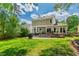 Lush backyard with a patio, outdoor seating, and a grilling area, perfect for relaxing and entertaining guests at 8613 Swarthmore Dr, Raleigh, NC 27615
