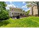 Expansive backyard with patio, seating, and grill; an ideal setting for relaxation and outdoor entertaining at 8613 Swarthmore Dr, Raleigh, NC 27615