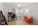 Bright bedroom with computer and desk, wooden floors, and comfortable seating by windows at 8613 Swarthmore Dr, Raleigh, NC 27615