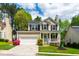 Charming two-story home with a well-manicured lawn and inviting front porch at 8613 Swarthmore Dr, Raleigh, NC 27615