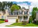 Charming two-story home with a well-manicured lawn and inviting front porch at 8613 Swarthmore Dr, Raleigh, NC 27615
