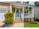 Close up of front porch with beautiful plants and welcome wreath at 8613 Swarthmore Dr, Raleigh, NC 27615
