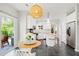 Open-concept kitchen with breakfast nook; features stainless steel appliances, a center island, and outdoor access at 8613 Swarthmore Dr, Raleigh, NC 27615