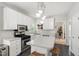 Beautiful kitchen with stainless steel appliances and island with seating at 8613 Swarthmore Dr, Raleigh, NC 27615